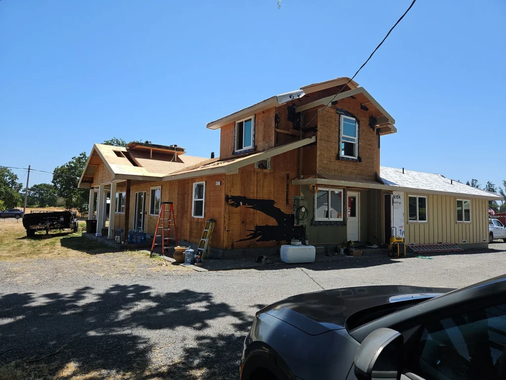 Residential home in santa rosa getting new metal siding with a new roof replacement